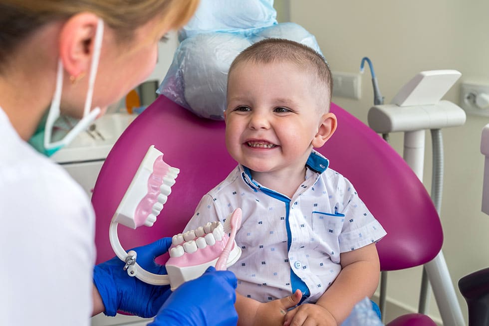 Child at a Pediatric dentist in Lawrence and Lenexa KS at Honey Bee Pediatric Dental Co.