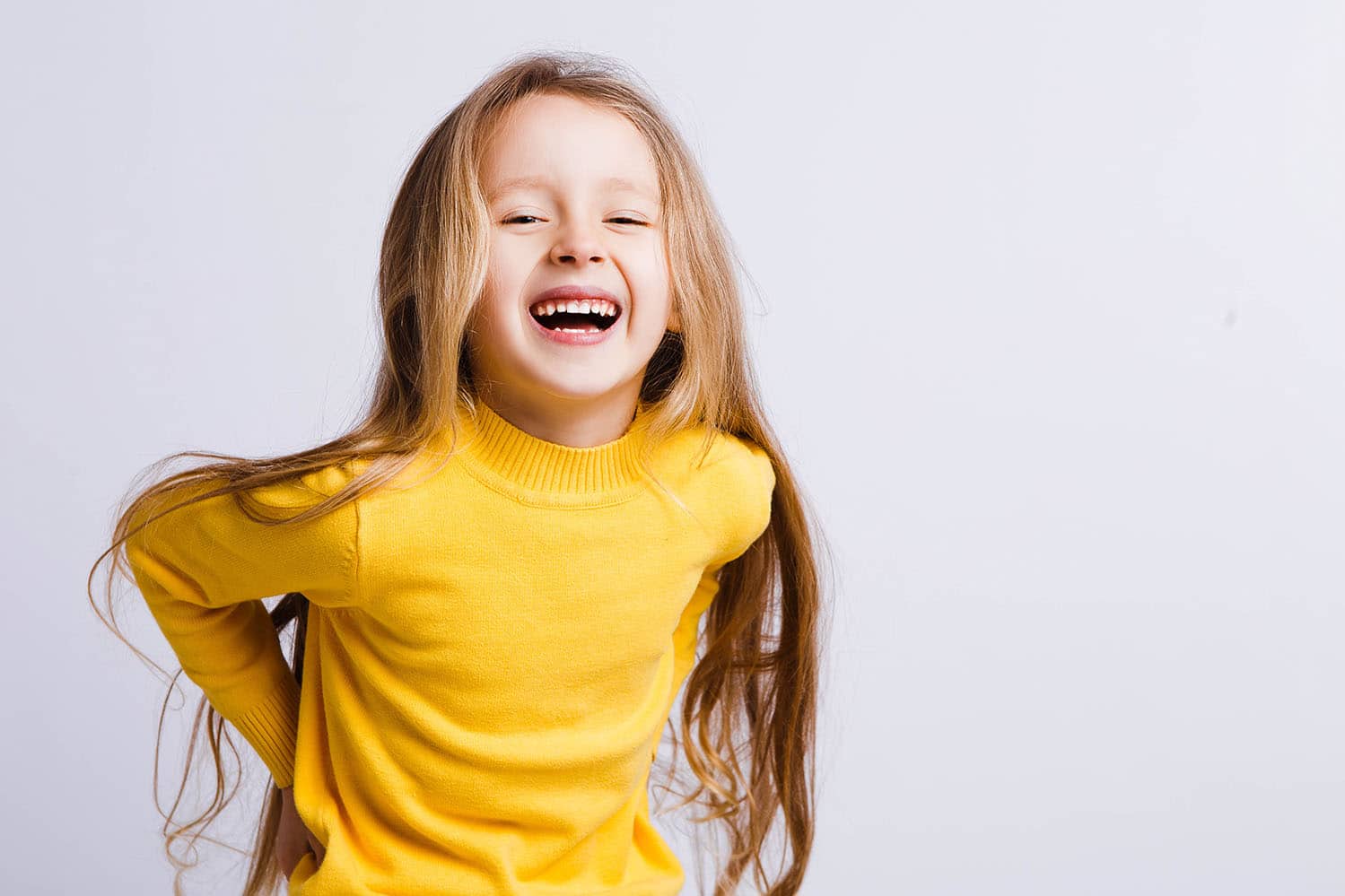 girl smiling Honey Bee Pediatric Dental Co in Lawrence, KS