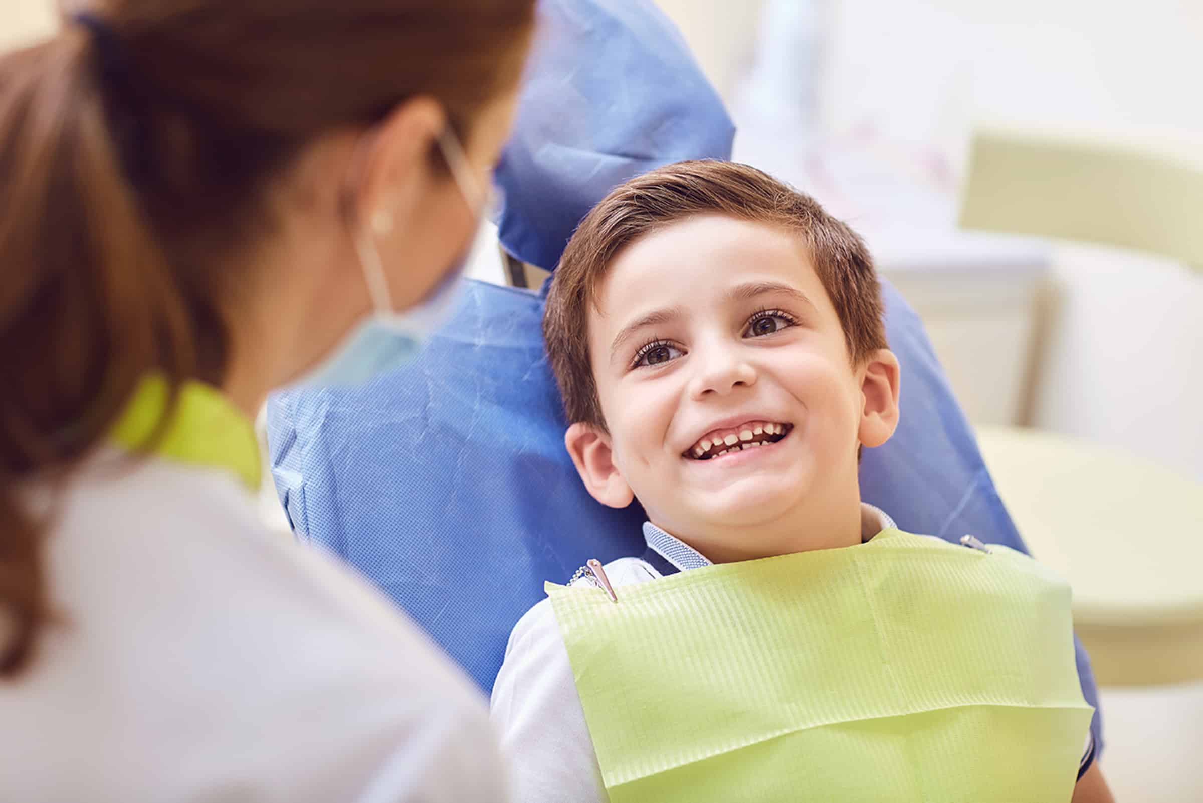 Young boy getting a dental extractions in Lawrence, KS