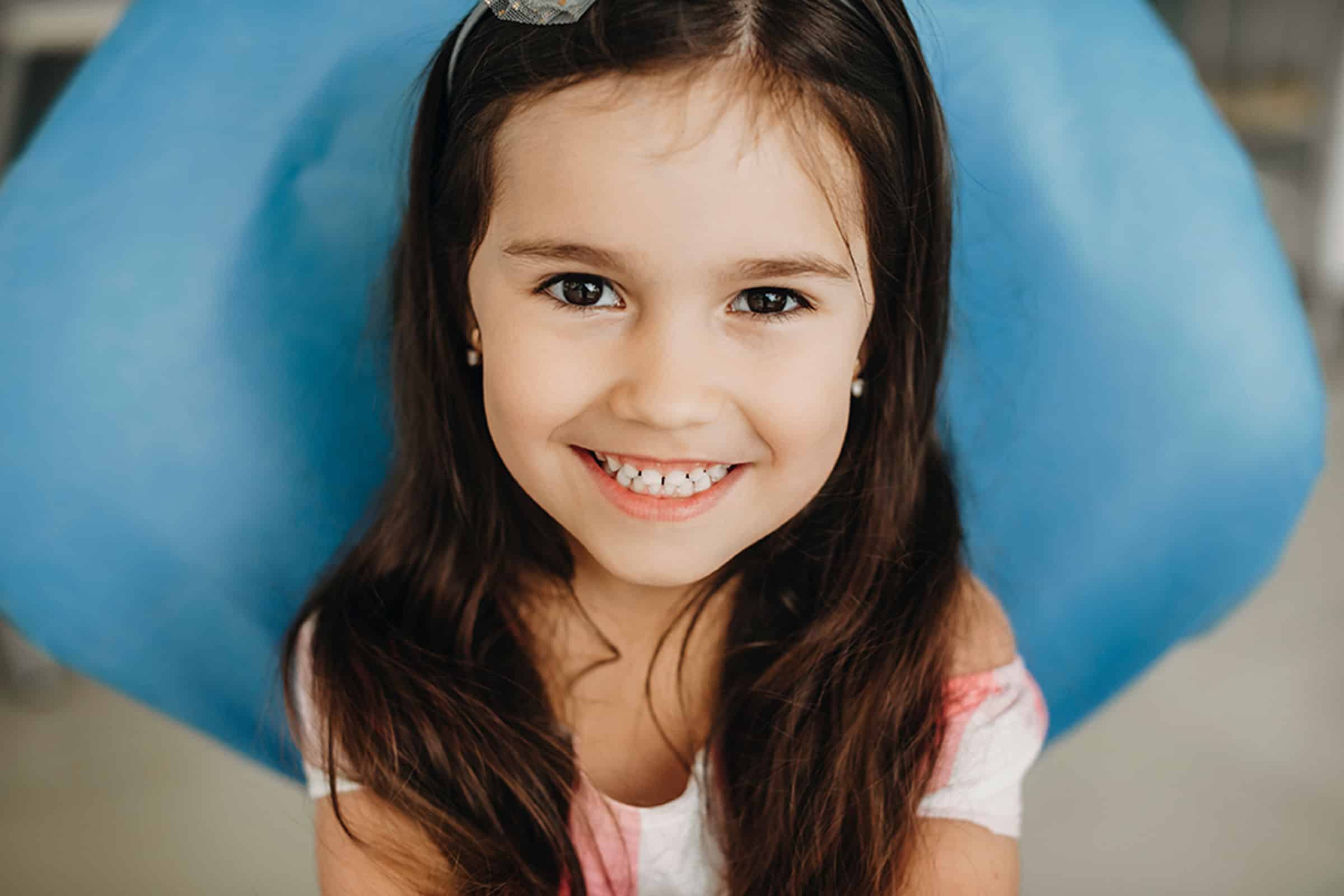 Girl after getting a tooth removed near Lenexa, KS