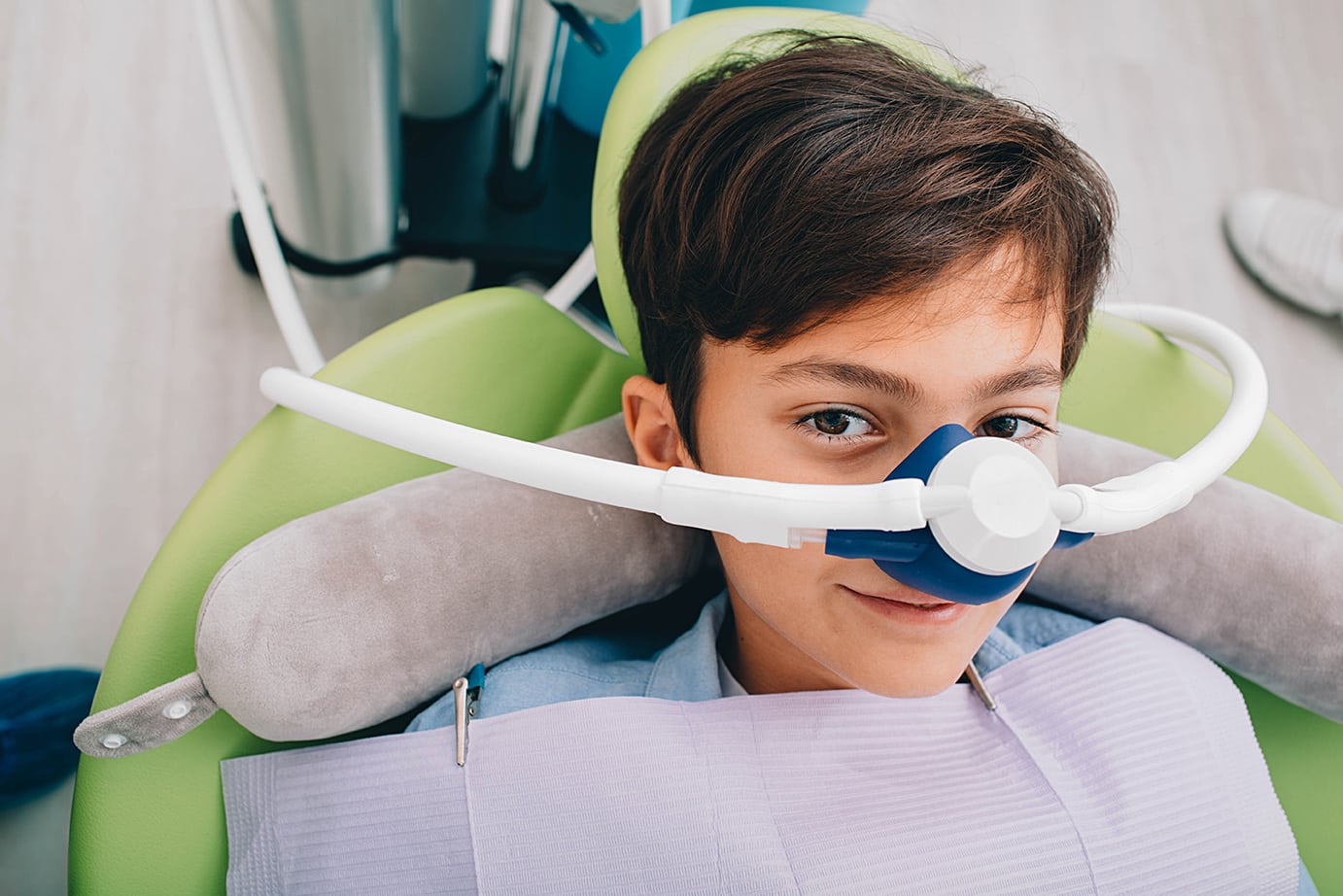 young dental patient during pediatric sedation appointment recieving nitrous oxide at honey bee pediatric dental co.