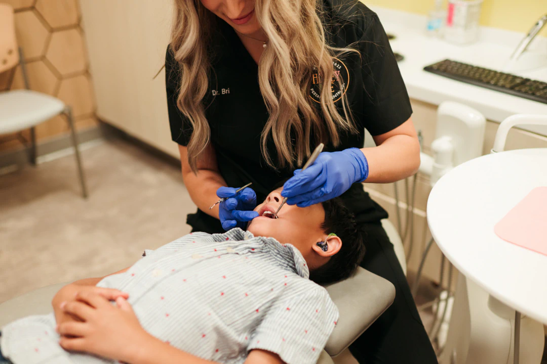 Child after a Dental exam in Lawrence and Lenexa KS at Honey Bee Pediatric Dental Co.